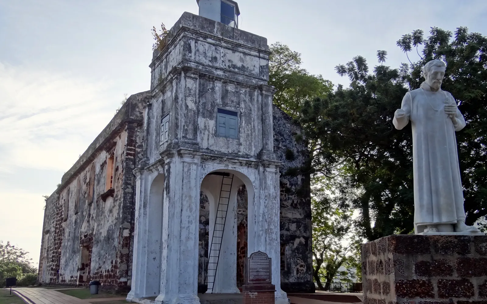 The roofless ruins of St. Paul's Church at the hilltop in Melaka, with views over the city and the Strait of Malacca