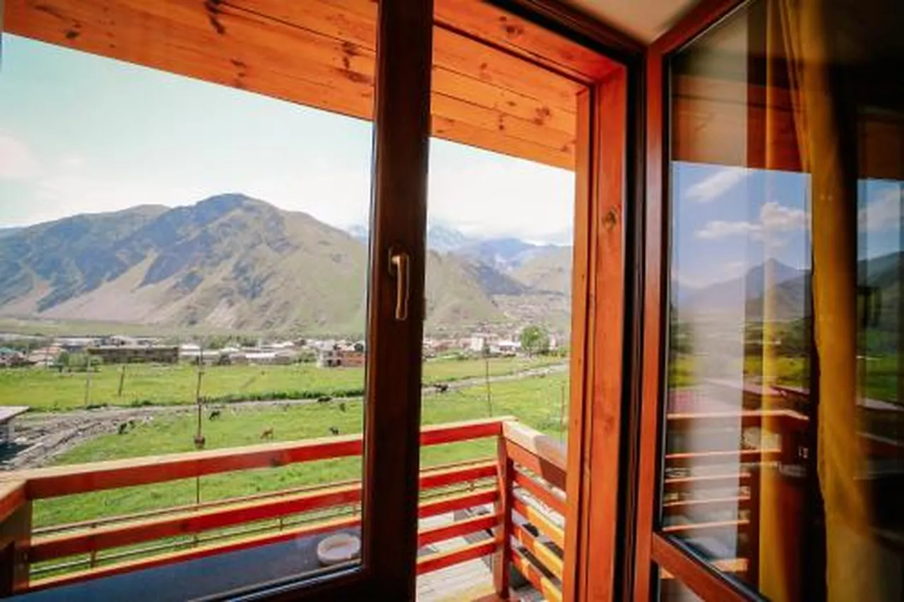 Alpenhaus Kazbegi Hotel & Restaurant — rooms and atmosphere