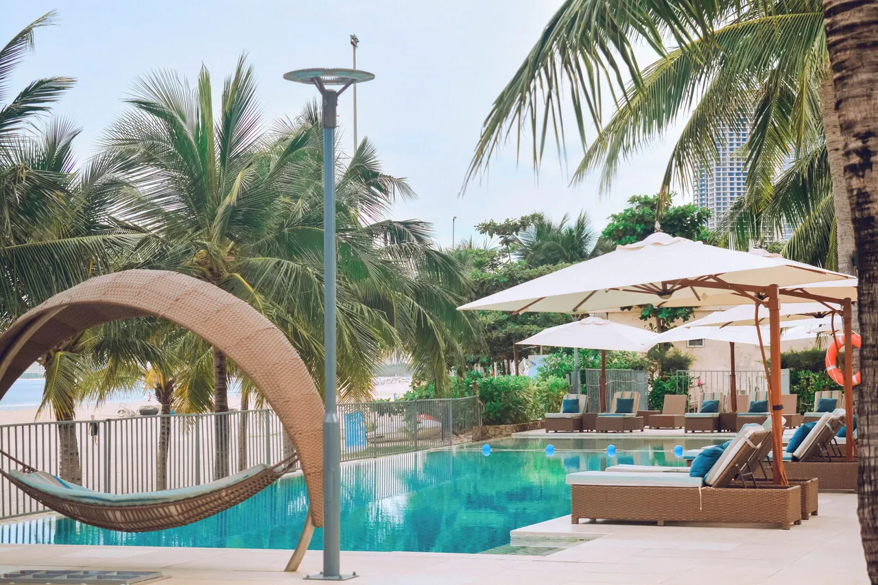 Fusion Suites Danang Beach — rooms and atmosphere