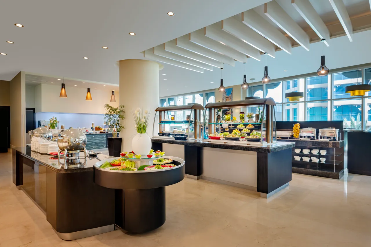 Grand Millennium Al Wahda Abu Dhabi — rooms and atmosphere