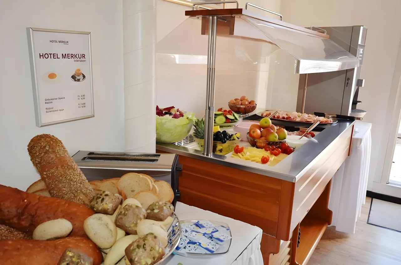 Hotel Merkur West Station Interlaken — rooms and atmosphere