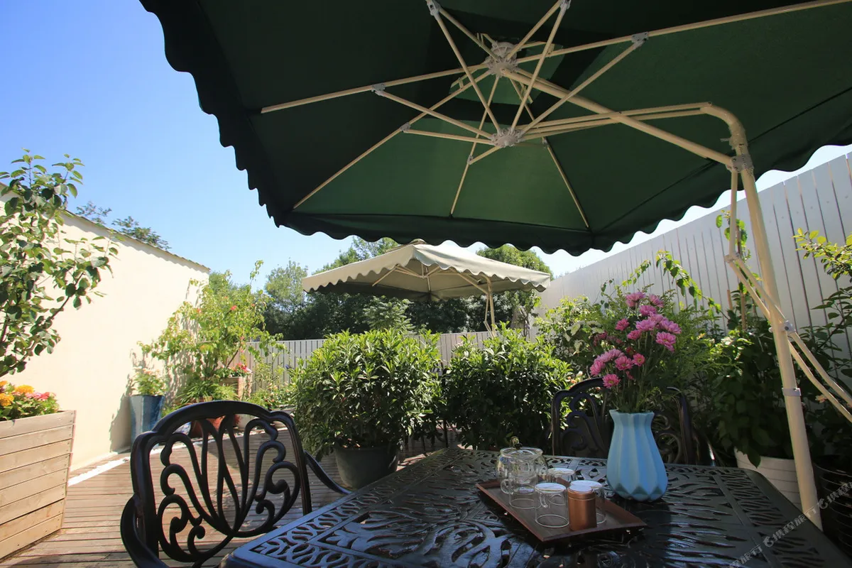 Xingshe Alley Courtyard Hotel Beijing — rooms and atmosphere